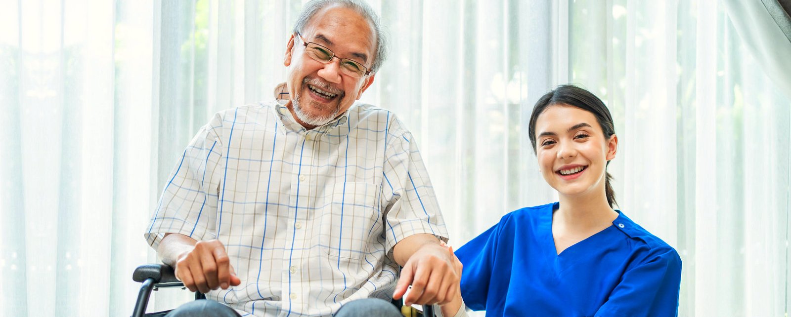caregiver smiling with her patient