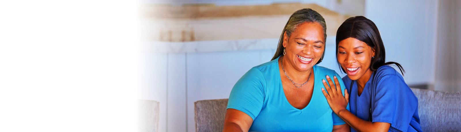 caregiver and her patient happily watching something