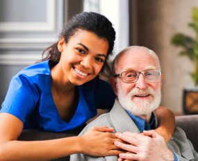 caregiver hugging her patient