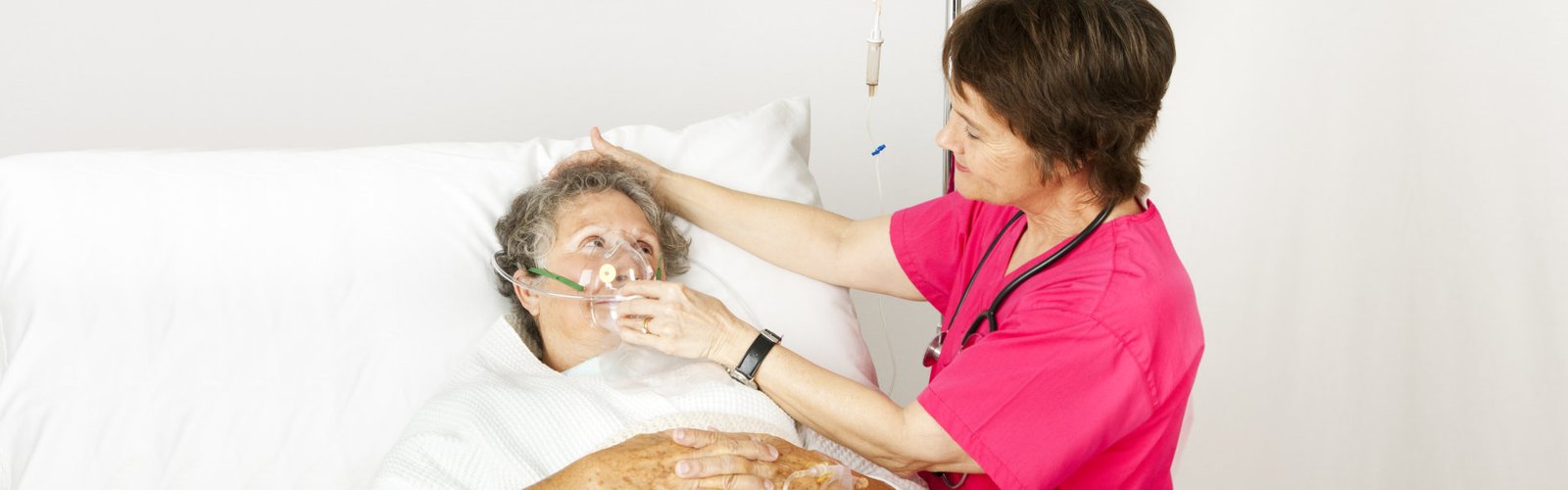 woman holding her patients ventilator mask